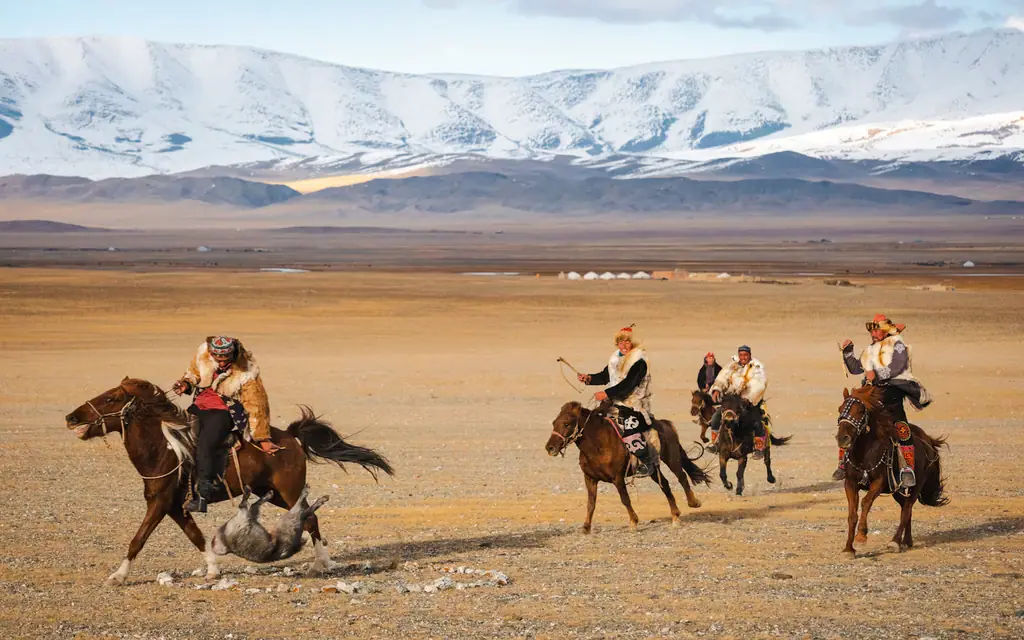 Kazakh riders racing in a game of kokpar