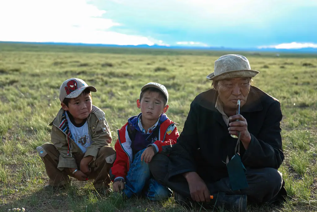 A herder and his grandsons on the summer pasture